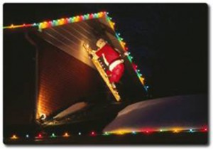 Lighted_Santa_on_ladder_under_eaves_with_Christmas_lights