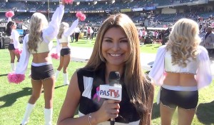 Claudia reporting from the field before the game.